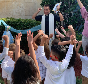 Kids celebrating with pastor